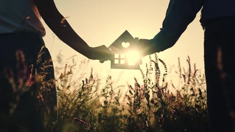 House at sunset. hand close-up. epotheca house purchase. dream to buy jelly Video stock 251457342
