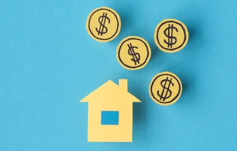 A house is surrounded by five dollar bills Stock Photos