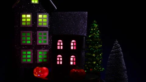 A house surrounded by glowing pumpkins and a candle, rotates against of a house Stock Footage 318916830