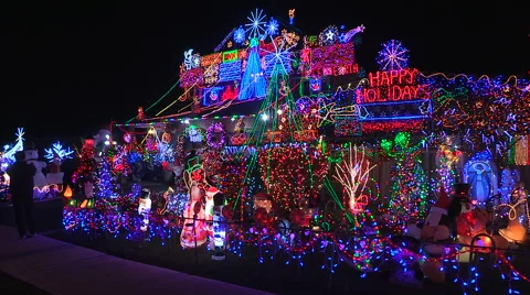 House with thousands of Christmas lights covering it Stock Footage 44754322