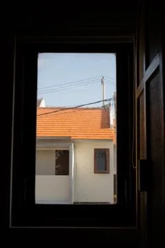 House throw the window Stock Photos