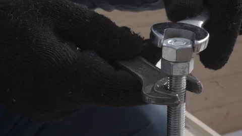 House of timber. Tightening the bars between each other with a nut and stud. Stock Footage 106628282