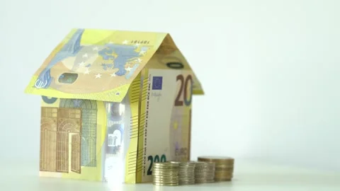 House on top of a large stack of money bills. Real estate mortgage concept shot. Stock Footage 145278583