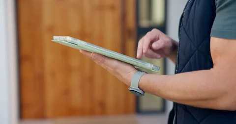 House, typing and hands of delivery man on tablet for shipping, order update and Stock Footage 335787535