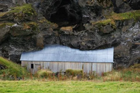 House under the cliff Stock Photos