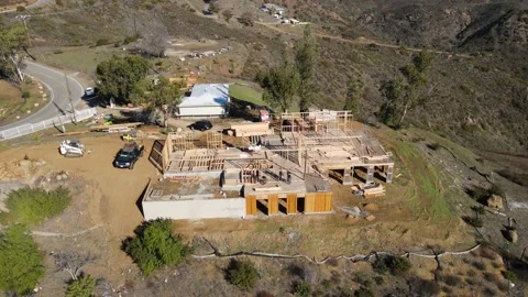 House under construction on a hilltop with a vineyard Stock-Footage 228794833