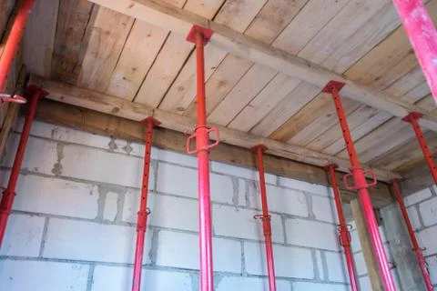 House under construction - installed props for pouring the concrete slab Stock Photos