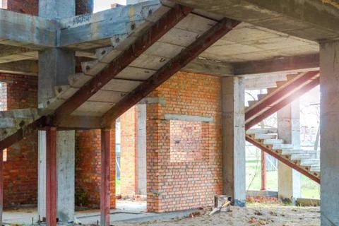 House under construction with red bricks. Stock Photos