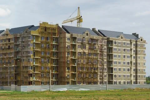 House under Construction in the residential complex Europe city on the street Stock Photos