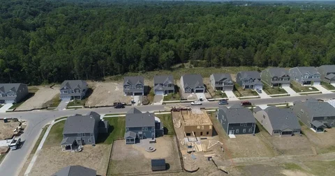 House under construction in row of newly developed houses drone aerial 4k Stock Footage 114140610