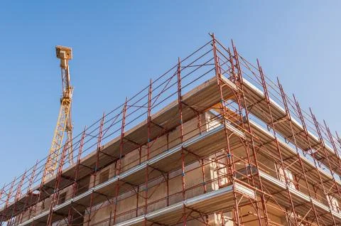 House under construction with scaffolding. Stock Photos