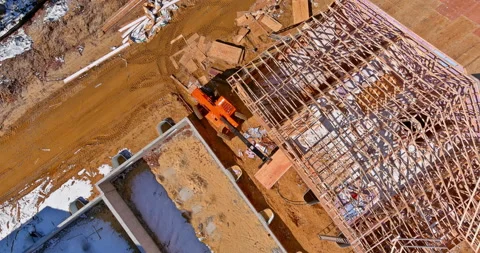House under construction worker is covering plywood the wooden with using Stock Footage 197387723