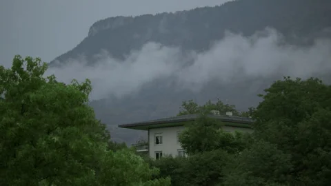 House under mountain mist Stock Footage 268229708