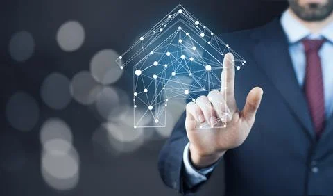 House on virtual screen in man hand Stock Photos