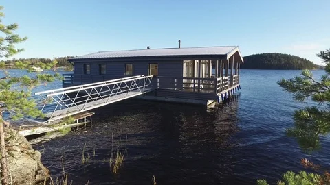 A house on the water by the lake Stock Footage 89763540