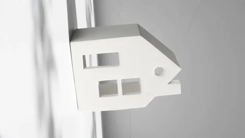 House white color miniature version on a light, vertical video. Stock Footage 196114760