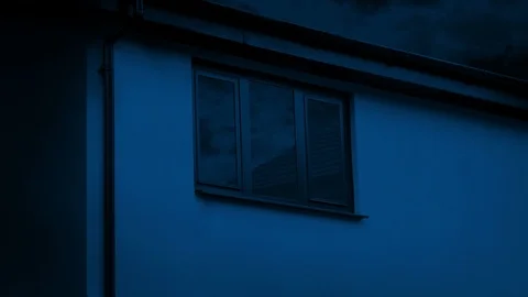 House Window With Passing Sky At Night Stock Footage