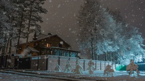 House in the winter forest, beautiful winter evening landscape with snowfall Stock Footage 97433264