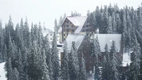 House in the winter forest with Snowfall Stock Footage 105740823