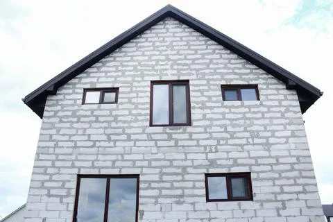 A house without a facade built from gas blocks. Construction concept Stock Photos