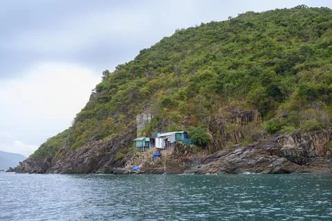 The house of workers mining bird nests on the rocks on a mountainous island Stock Photos