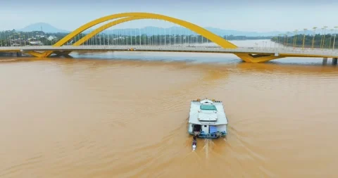 Houseboat on Perfume River under Cau Nguyen Hoang Bridge, Hue, Vietnam Stock-Footage 330754269