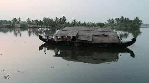 A houseboat is reflected in evening waters India Stock Footage 24552525