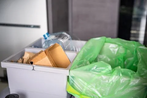 Household bins for waste sorting in the kitchen for recycle. Plastic, paper, bio Stock Photos