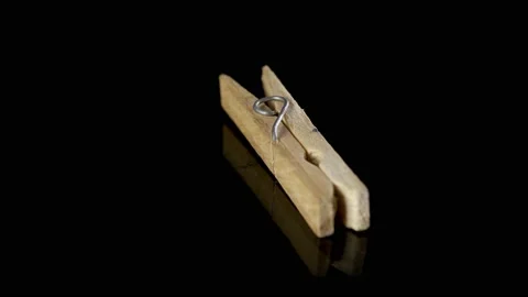 Household Clip Spinning and Rotating Isolated on black Background Stock Footage 223230341