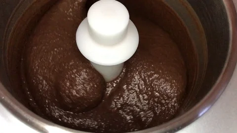 Household ice cream maker stirring chocolate ice cream Stock Footage 118526724