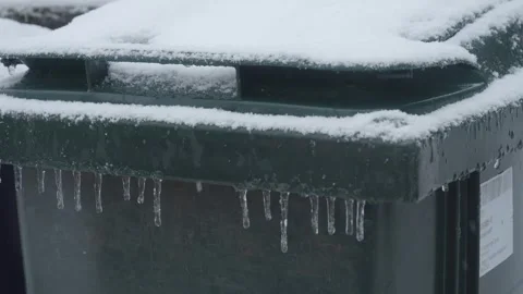 Household Waste Bin Covered with Snow, Winter and waste collection problem scene Stock Footage 275026282