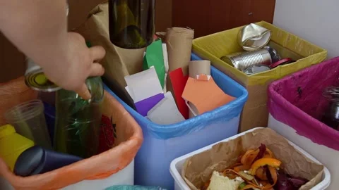 Household waste separation. Separate collection of domestic waste paper, plastic Stock Footage 188640792