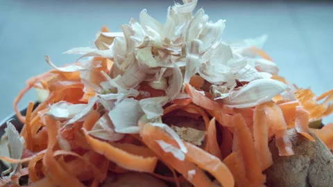 Household waste sorting. Biowaste piled in a bowl. Stock Footage 313989487