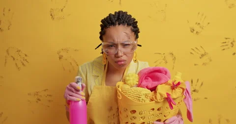 Household work concept. Dark skinned serious housemaid dispensing detergent from Stock Footage 152921907