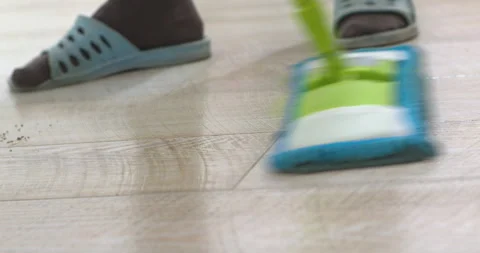 Housekeeper cleaning floor with microfiber mop Stock Footage 305648392