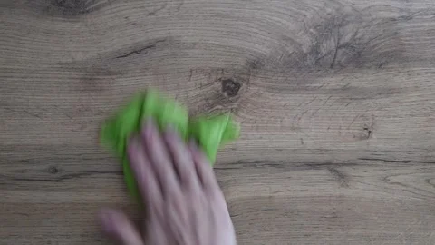 Housekeeper Cleaning Wooden Table Surface with Green Cloth Vídeo Stock 316877902