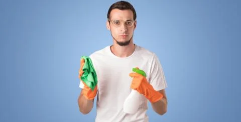Housekeeper in front of a blue empty wall Stock Photos