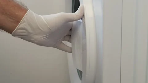 Housekeeper Loading the Washing Machine with Clothes. Vídeos de archivo 255502135