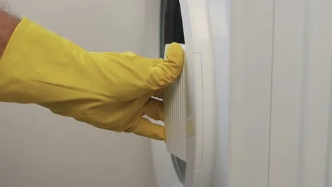Housekeeper Loading the Washing Machine with Dirty Clothes.  Vídeos de archivo 238449848