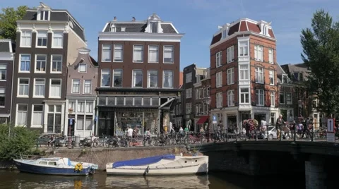 Houses along canals with bridge,Amsterdam,Netherlands Stock Footage