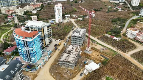 Houses construction process. Construction of a residential complex Stock Footage 223681301