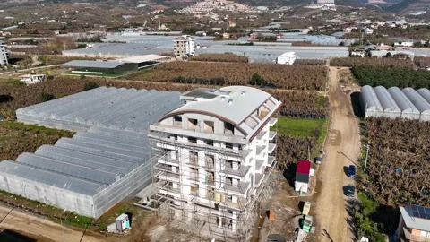 Houses construction process. Construction of a residential complex Stock Footage 223683850