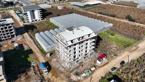 Houses construction process. Construction of a residential complex Stock Footage 223684630
