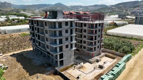 Houses construction process. Construction of a residential complex Stock Footage 223686613