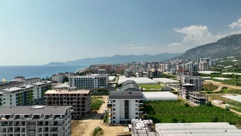 Houses construction process. Construction of a residential complex Stock Footage 223690184