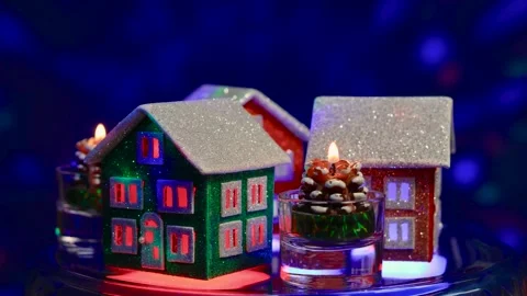 Houses rotate among candles in the shape of pine cones Stock Footage 290416341