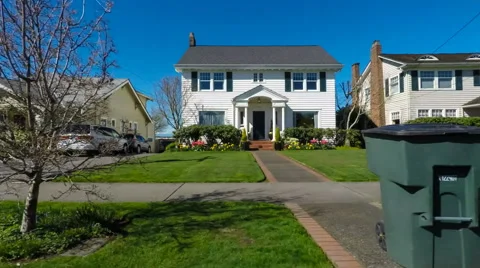 Houses viewed by driving through an American suburban neighborhood Stock Footage