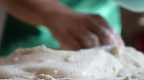 Housewife adding yeast into the flour Stock Footage 49807152