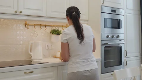 Housewife doing household chores, woman ... | Stock Video | Pond5