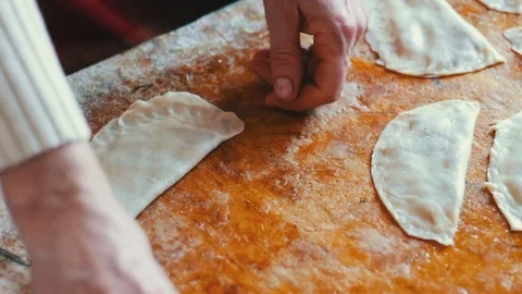 Housewife roasts chebureks in pan - Georgian national dish Stock Footage